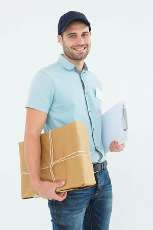 Portrait of happy courier man with parcel on white background