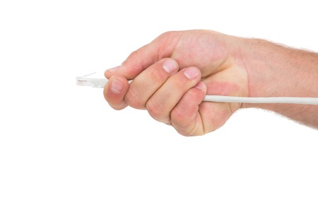 Businessman holding a cable on white background