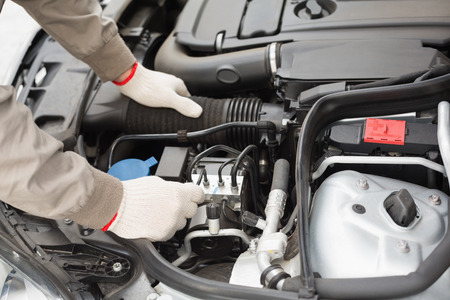 Man checking the engine of his car close up