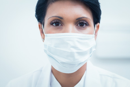 Portrait of female dentist wearing surgical maskの写真素材