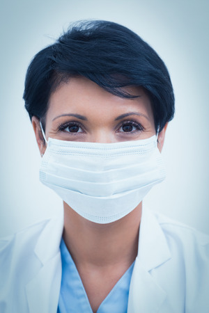 Portrait of female dentist wearing surgical maskの写真素材