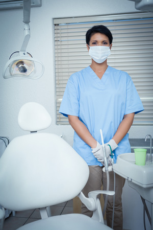 Portrait of female dentist wearing surgical maskの写真素材