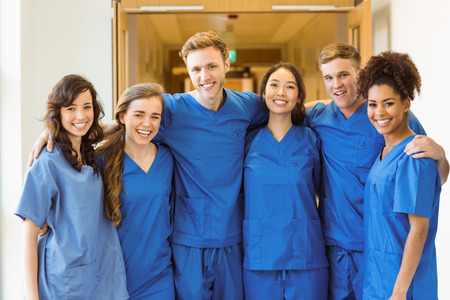 Medical students smiling at the camera at the universityの写真素材