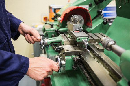 Engineering student using heavy machinery at the universityの写真素材