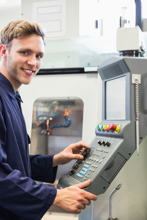 Engineering student smiling at camera at the universityの写真素材