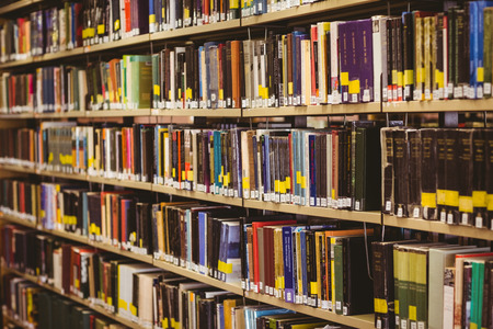 Close up of a bookshelf in libraryの写真素材