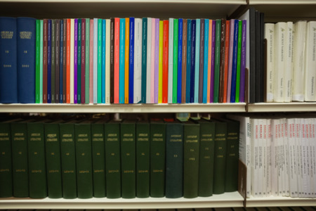 Volumes of books on bookshelf in library at the university