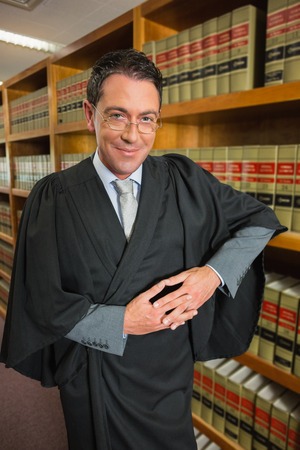 Lawyer looking at camera in the law library at the universityの写真素材
