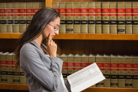 Lawyer reading in the law library at the university