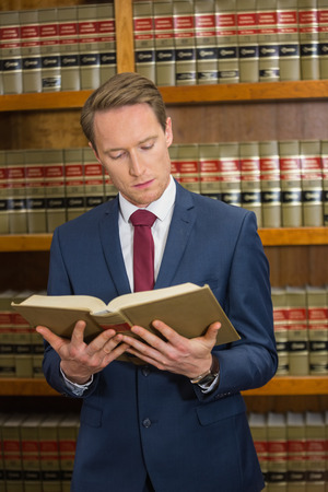 Lawyer reading in the law library at the universityの写真素材