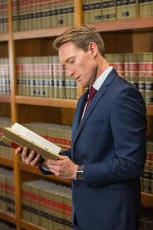 Handsome lawyer in the law library at the universityの写真素材