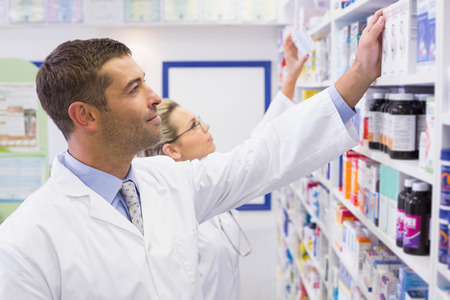 Team of pharmacists looking at medicine at the hospital pharmacy