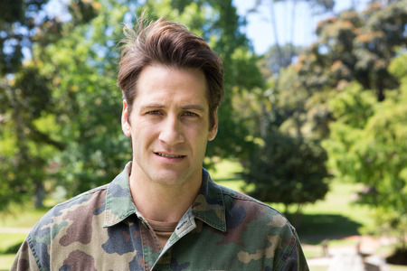 Distressed soldier looking at camera on a sunny dayの写真素材