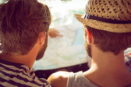Hipster friends on road trip on a summers day
