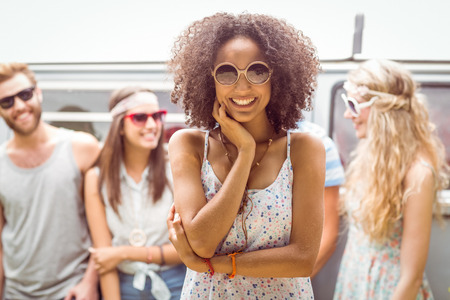 Hipster friends smiling at camera on a summers dayの写真素材