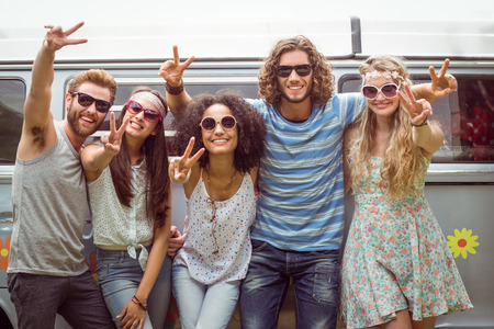 Hipster friends smiling at camera on a summers dayの写真素材