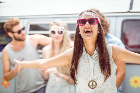 Pretty hipster smiling at camera on a summers dayの写真素材