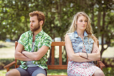 Young couple not talking after argument on a summers dayの写真素材