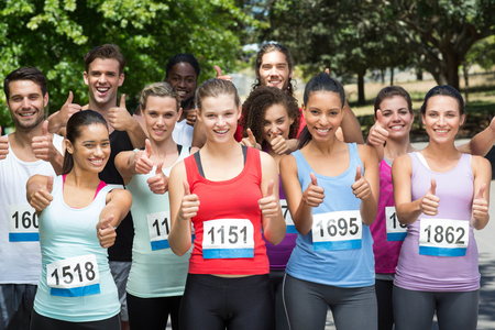 Fit people at race in park on a sunny dayの写真素材