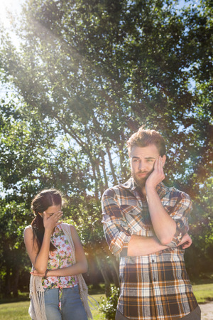 Young couple having an argument on a summers dayの写真素材