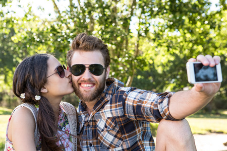 Young couple taking a selfie on a summers dayの写真素材