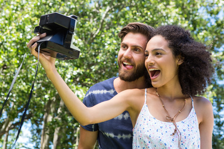 Hipster couple taking a selfie on a summers day