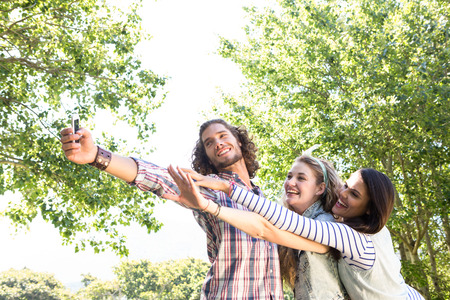 Happy friends taking a selfie on a summers dayの写真素材