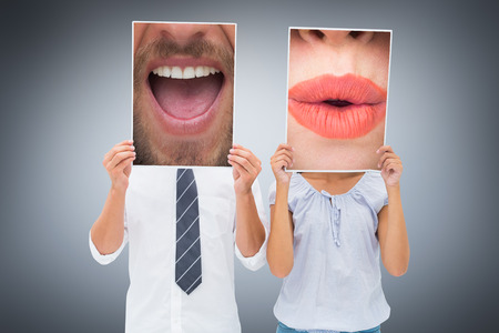 Close up of talking man against grey vignetteの写真素材