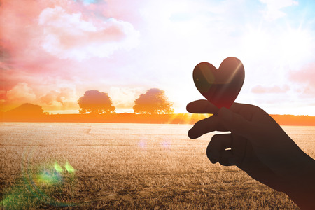 heart against countryside sceneの写真素材