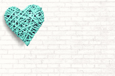 Large heart on white wallの写真素材