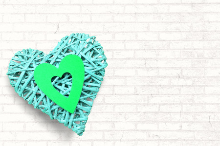 Large heart on white wallの写真素材