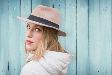 Pretty hipster blonde against wooden planksの写真素材