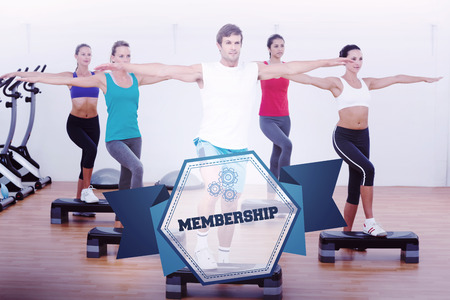 The word membership and fitness class performing step aerobics exercise against hexagon