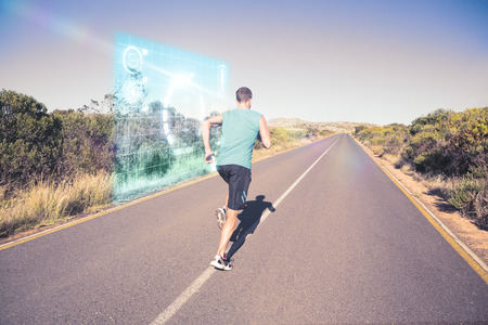 Fit man jogging on the open road  against fitness interface