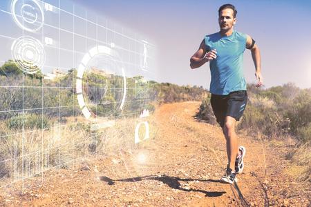 Athletic man jogging on country trail against fitness interface