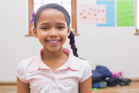 Smiling pupil in classroom at the elementary school