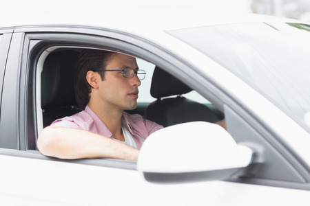 Focus man driving in his carの写真素材