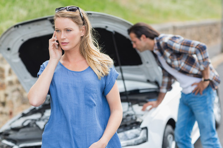 Couple after a car breakdown at the side of the road