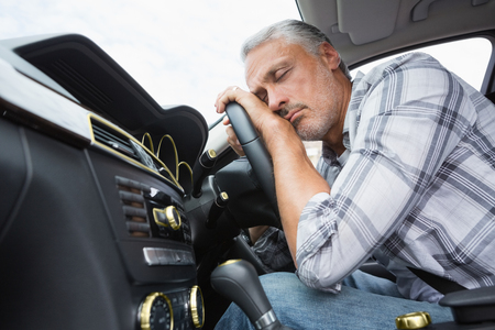 Drunk man slumped on steering wheel in his car