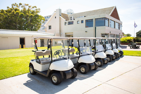 Golf buggy at the golf course parkingの写真素材
