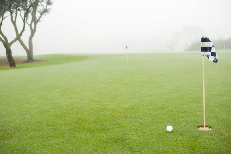 Golf links and golf ball on a cloudy dayの写真素材