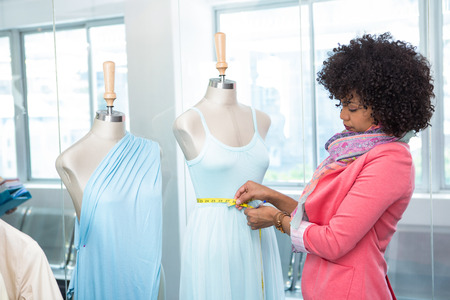 Side view of attractive female fashion designer at workの写真素材