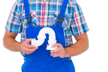 Cropped image of male plumber holding sink pipe on white backgroundの写真素材