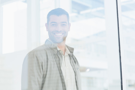 Portrait of smiling business in officeの写真素材