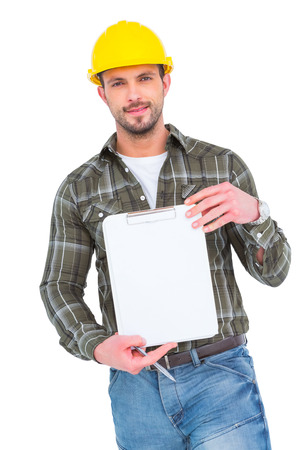 smiling manual worker holding clipboard on white backgroundの写真素材