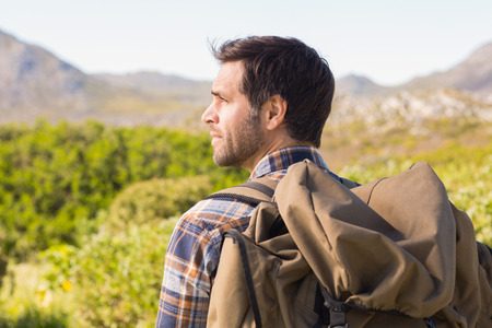Man hiking in the mountains on a sunny day