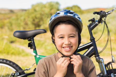 Little boy on a bike ride on a sunny dayの写真素材
