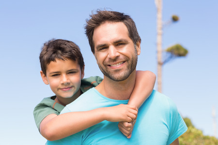 Father and son in the countryside on a sunny dayの写真素材