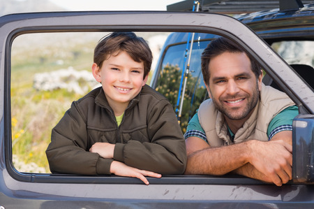 Father and son on a road trip on a sunny dayの写真素材