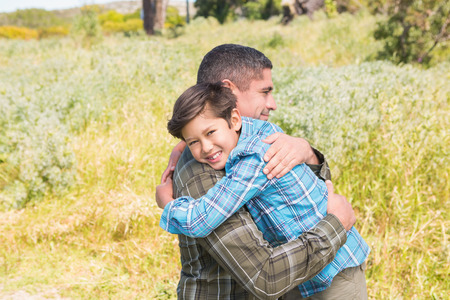 Father and son in the countryside on a sunny dayの写真素材